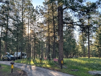RV and truck parked an RV site at the Sheridan Lake Campground in the Black Hills of South Dakota.