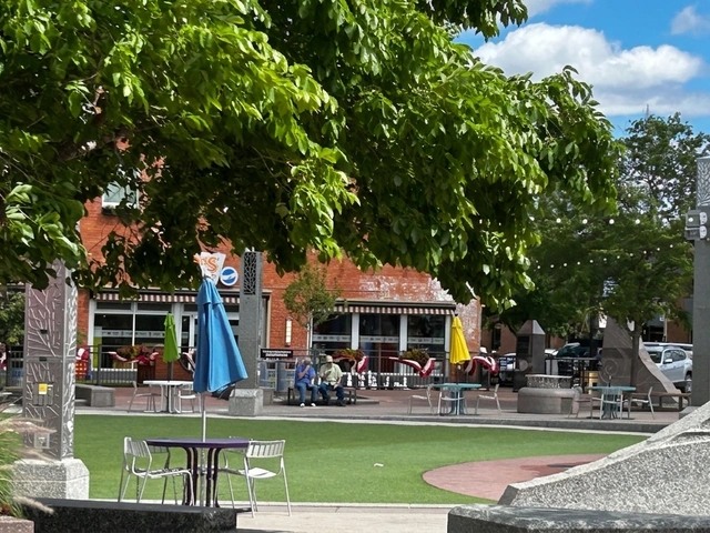 Splash pad and picnic tables at Main Street Square in Rapid City, South Dakota.