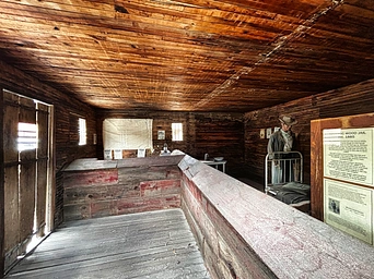 Interior of the 1888 historic Hot Springs, SD jail. Staged with items from the late 1800s.