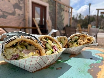 Silk Road Experience smoked lamb paratha roll in outdoor dining space on River Street in Hot Springs, SD.