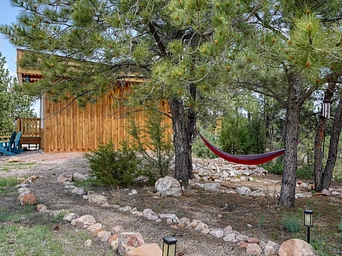 Hammock in Ponderosa pines near cabin rental on resort property in Hot Springs, SD.