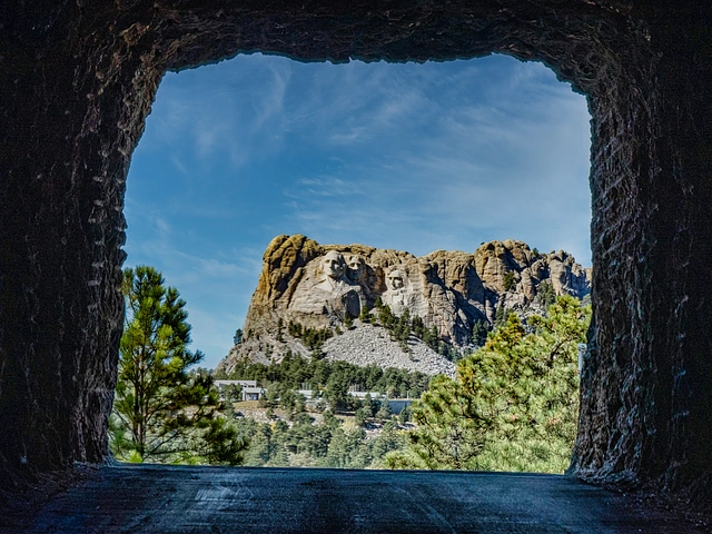 Tunnel along the Iron Mountain Road in Custer State Park, SD - Mount Rushmore in the background.
