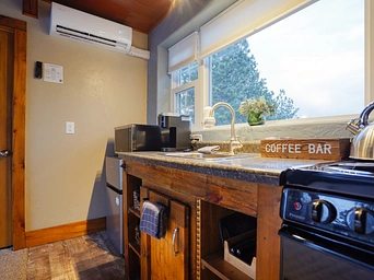 Kitchen and mini-split in Hot Springs cabin vacation rental at Highland Meadows Resort.