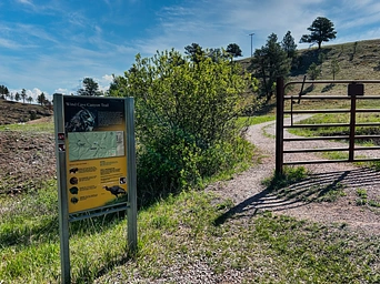 The trail marker/sign at the trailhead for Wind Cave Canyon Trail and Highland Creek Trail. Near Hot Springs, SD.