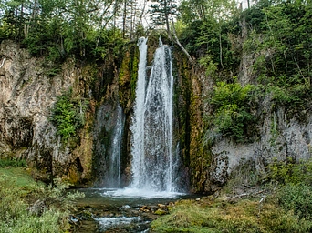 Spearfish Falls in the Black Hills of South Dakota. Waterfall down a shear rock cliff.