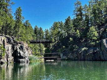 Bridge over Sheridan Lake in the Black Hills - part of the Spring Creek / Shoreline hiking trail. As seen from the water.