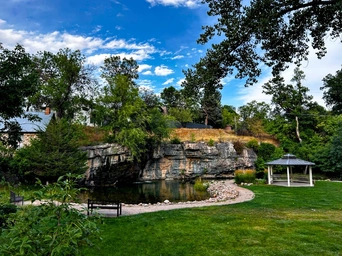 Indian Springs park in Spearfish South Dakota. Waterfall, pond, gazebo, and park benches perfect stop on vacation.
