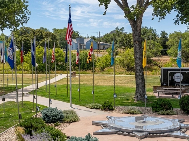 The geographic center of the nation monument in South Dakota. Flags, trees, and wispy clouds.