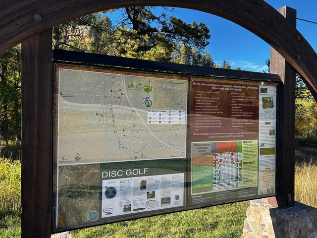 Sign and map of the Spearfish disc golf course up the scenic canyon - at the top end of the Recreation Path.