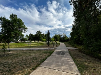 Spearfish Recreation Trail as it winds through Jorgenson Park in the Black Hills. Paved path.