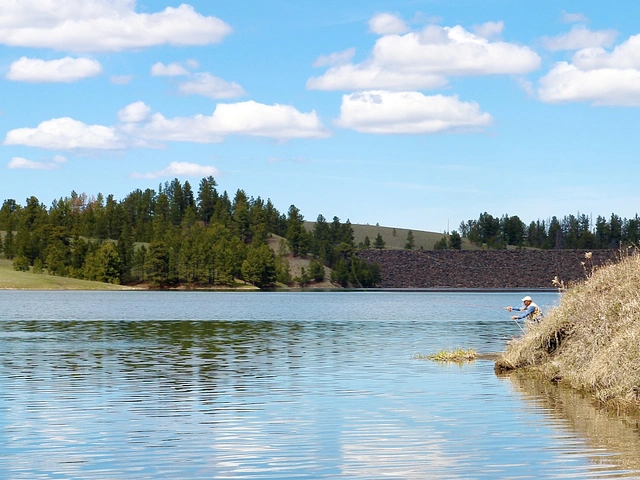 Man fishing at Deerfield Reservoir in the Black Hills of South Dakota.
