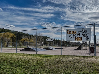 Fence with ramps and slopes in a skate park in Custer, SD.
