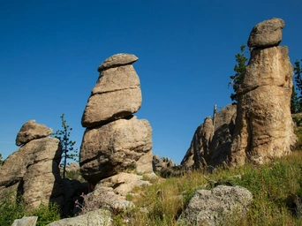 Balanced rocks and hoodoos along the Needles Highway. Blue skies in the Black Hills of South Dakota.