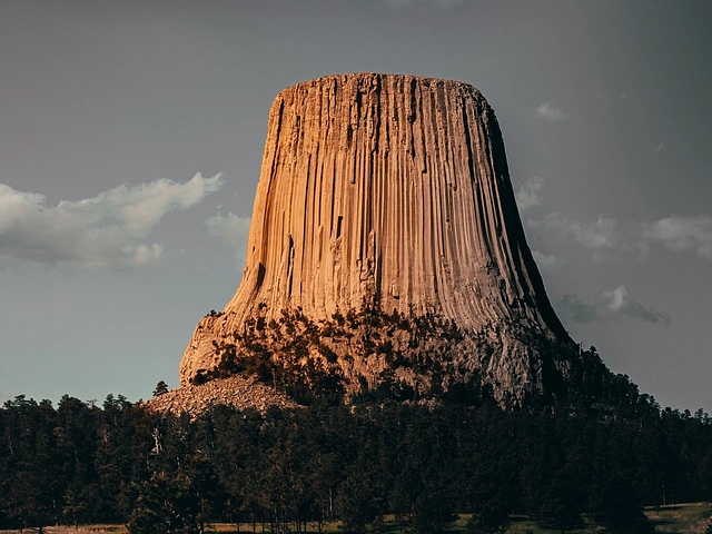Devils Tower in Wyoming - outcropping against a gray and cloudy sky.