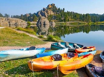 Kayaks on the shore of Sylvan Lake in the Black Hills of South Dakota.