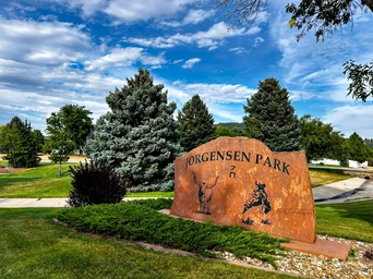 The stone sign at the entrance of Jorgensen Park in South Dakota, right along the Spearfish Rec Path walking trail.